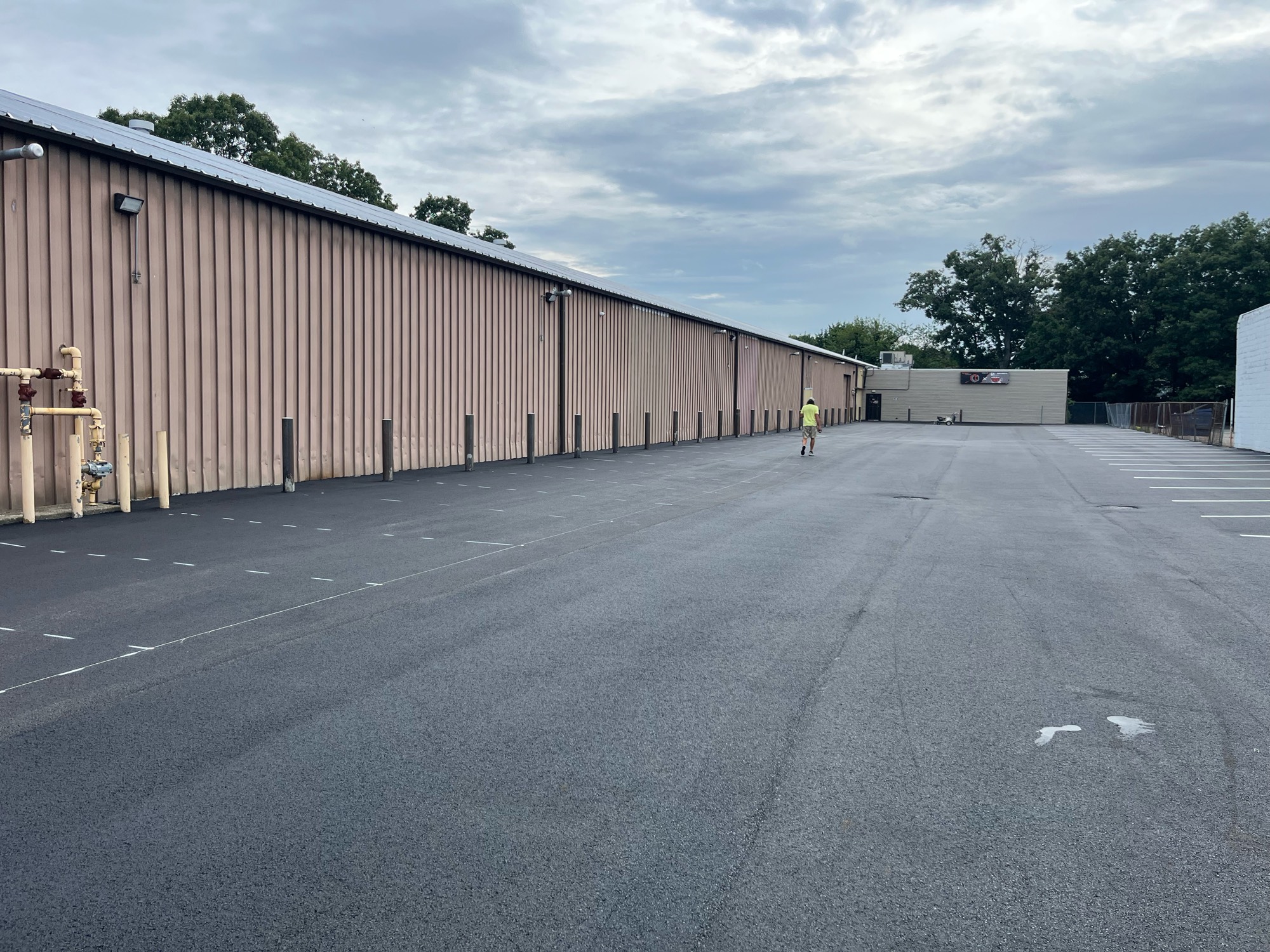 Why 2,000 Feet of Crack Sealing Came Before a North Merrick Parking Lot Overlay